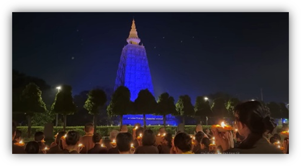 A group of people standing in front of a blue tower

AI-generated content may be incorrect.